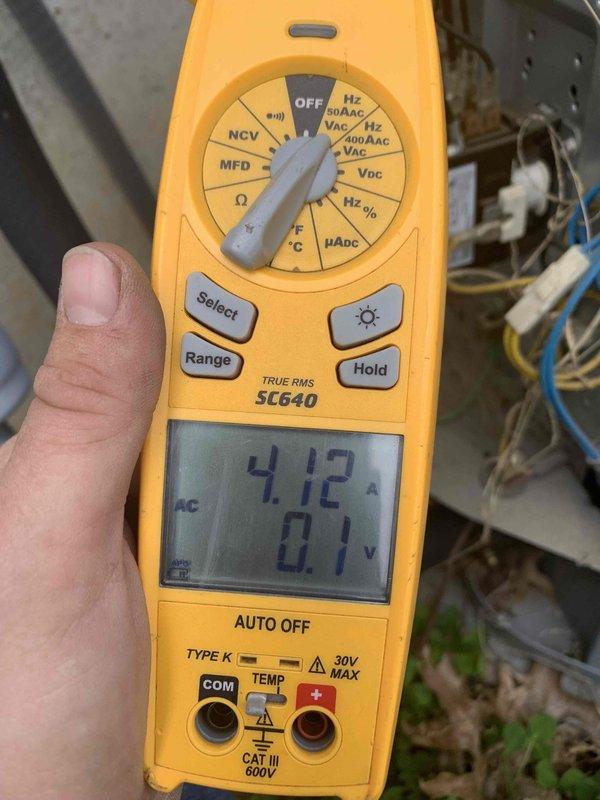 # HVAC Cooling System Tune-Up - Two Units

Completed comprehensive preventive maintenance tune-up on two residential air conditioning systems per U10 protocol. One unit located on exterior pad, second unit in attic space. Both systems under ten years of age.

## Work Performed

Conducted full system inspections on both cooling units including visual assessment of all major components. Measured and recorded electrical parameters using digital multimeter, verifying amperage draw and voltage levels within manufacturer specifications. Current draw measured at 4.12 amps with 0.1 volts displayed during diagnostic testing.

Inspected evaporator coils on both systems, noting accumulated dust and debris on coil fins requiring attention during routine maintenance cycle. Examined refrigerant line sets, observing significant deterioration of pink foam insulation sleeves with exposed sections showing wear and fragmentation. Copper refrigerant lines displayed moderate to heavy surface oxidation and 