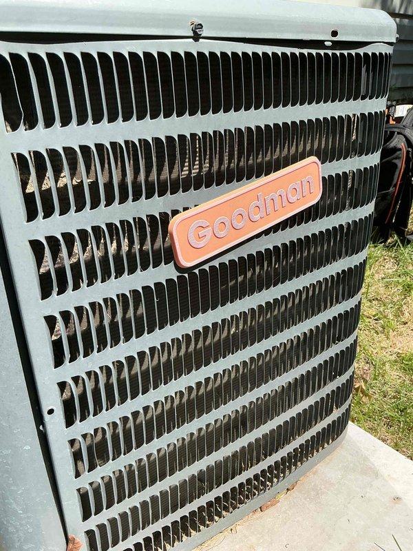 Completed preventive maintenance tune-up on a 10-year-old Goodman air conditioning system. Inspected outdoor condensing unit, verified proper airflow through grille assembly, and examined internal control panel wiring connections and circuit board components. All electrical connections, relay operation, and safety labels were checked and found to be in satisfactory working condition.