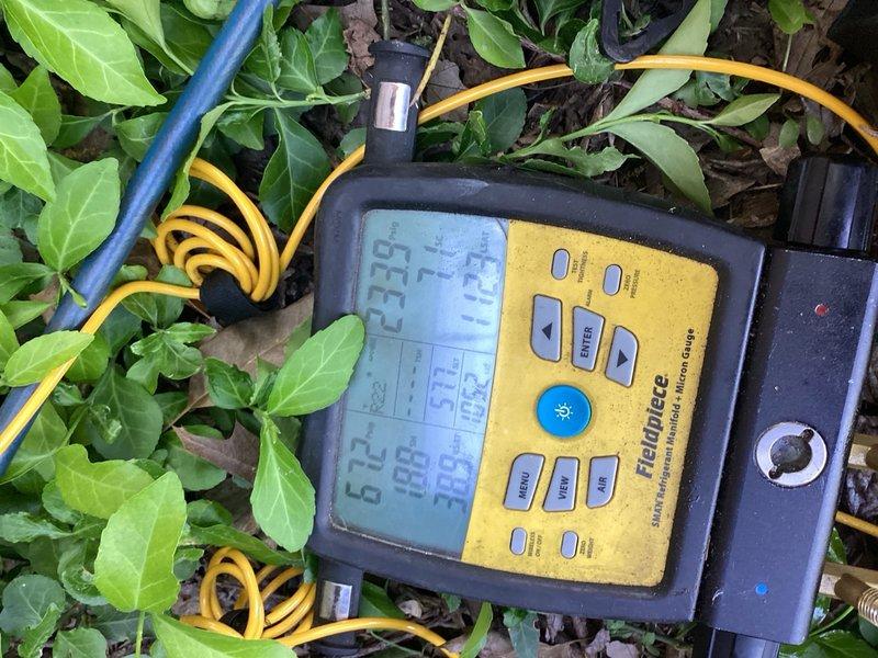 Responded to cooling efficiency complaint on 15-year-old air conditioning system. Performed diagnostic testing using digital manifold gauges to assess refrigerant pressures and system performance. Added refrigerant charge to restore proper cooling capacity. Replaced faulty condensate drain line in basement that was improperly fitted and causing water leakage. System tested and confirmed operating within normal parameters upon completion.