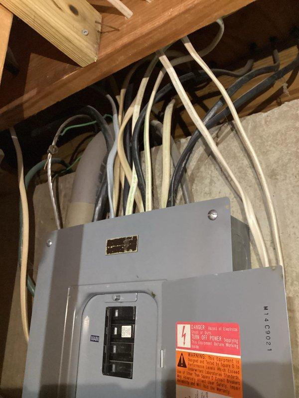 Completed comprehensive whole-house electrical inspection of residential property. Thoroughly examined main electrical panel located in unfinished utility area, verifying proper circuit breaker operation, conductor connections, and panel labeling compliance. Inspected junction boxes, conduit installations, and wire routing throughout ceiling joists and structural framing. All electrical components, connections, and safety labeling were assessed for code compliance and proper installation standards. Documented findings with photographic evidence of electrical infrastructure conditions.