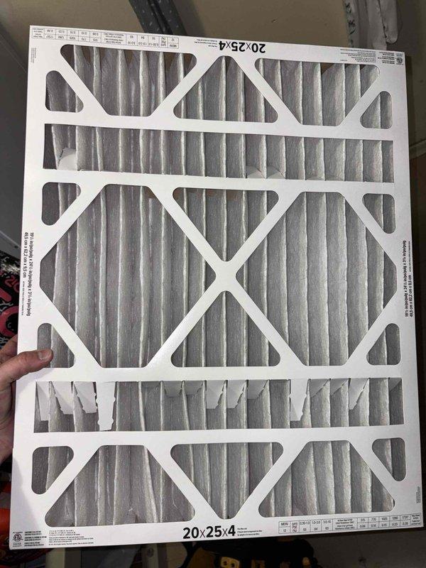 Completed cooling season tune-up on 7-year-old outdoor AC unit. Performed comprehensive system inspection including coil examination, which revealed significant dirt and debris accumulation on evaporator coil fins affecting airflow efficiency. Replaced 20x25x4 air filter with new pleated media filter to ensure proper system filtration and airflow. Inspected refrigerant lines and copper tubing for proper connections and insulation integrity. System operational upon completion of maintenance procedures.
