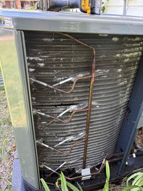 Completed cooling season tune-up on 7-year-old outdoor AC unit. Performed comprehensive system inspection including coil examination, which revealed significant dirt and debris accumulation on evaporator coil fins affecting airflow efficiency. Replaced 20x25x4 air filter with new pleated media filter to ensure proper system filtration and airflow. Inspected refrigerant lines and copper tubing for proper connections and insulation integrity. System operational upon completion of maintenance procedures.