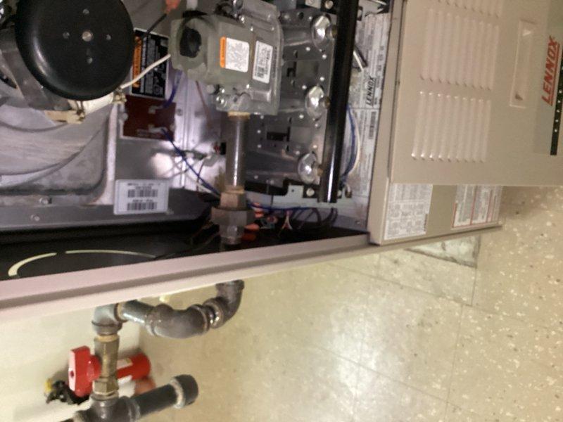 Responded to service call for 23-year-old Lennox furnace system located in basement. Per gas inspection requirements, removed existing union fitting from inside furnace cabinet and installed replacement union to bring gas piping connections up to code compliance. System was operational at time of service. Verified proper gas flow, tested all connections for leaks, and confirmed safe operation of burner assembly and gas valve upon completion of union replacement.