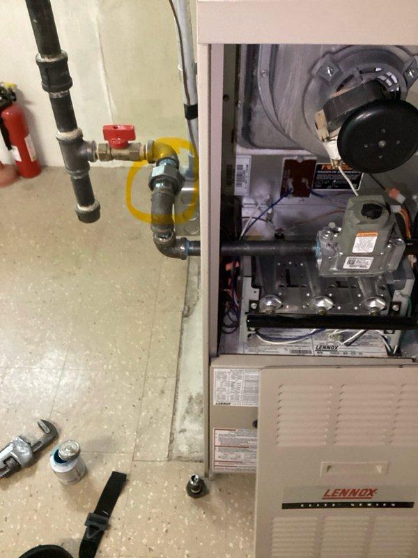 Responded to service call for 23-year-old Lennox furnace system located in basement. Per gas inspection requirements, removed existing union fitting from inside furnace cabinet and installed replacement union to bring gas piping connections up to code compliance. System was operational at time of service. Verified proper gas flow, tested all connections for leaks, and confirmed safe operation of burner assembly and gas valve upon completion of union replacement.