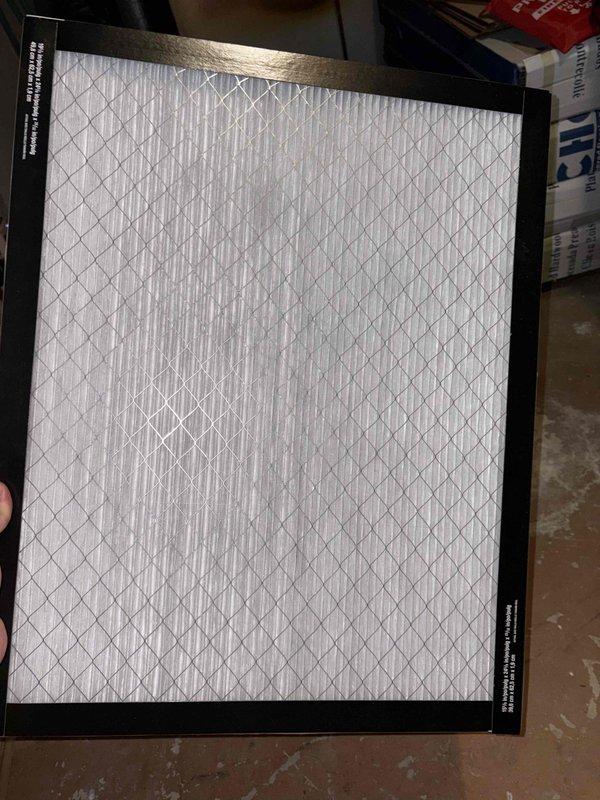 Responded to customer report of excessive noise from air conditioning unit upon seasonal startup. Performed diagnostic inspection of ground-level condenser and basement air handler components. Identified source of loud mechanical noise resembling lawn mower sound. Inspected blower assembly, motor mounts, and internal components for loose hardware, debris, or mechanical failure. Examined electrical connections and control boards within air handler cabinet, noting rust staining on interior base panel indicating previous moisture exposure. Verified proper airflow and cooling operation throughout system. Installed new air filter with clean pleated media. Unit restored to normal operating sound levels while maintaining cooling capacity.
