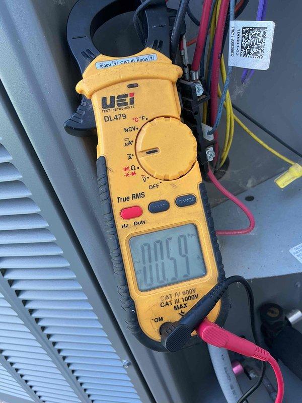 # HVAC Cooling System Tune-Up Completed

Performed comprehensive seasonal tune-up on 7-year-old residential air conditioning unit located at side of home. Conducted complete system diagnostics using digital multimeter to verify electrical performance, measuring voltage and amperage at critical components to ensure proper operation within manufacturer specifications. All electrical connections were inspected and tested, with readings confirming system is operating safely and efficiently. Standard preventive maintenance procedures completed on single cooling unit during scheduled afternoon service window.