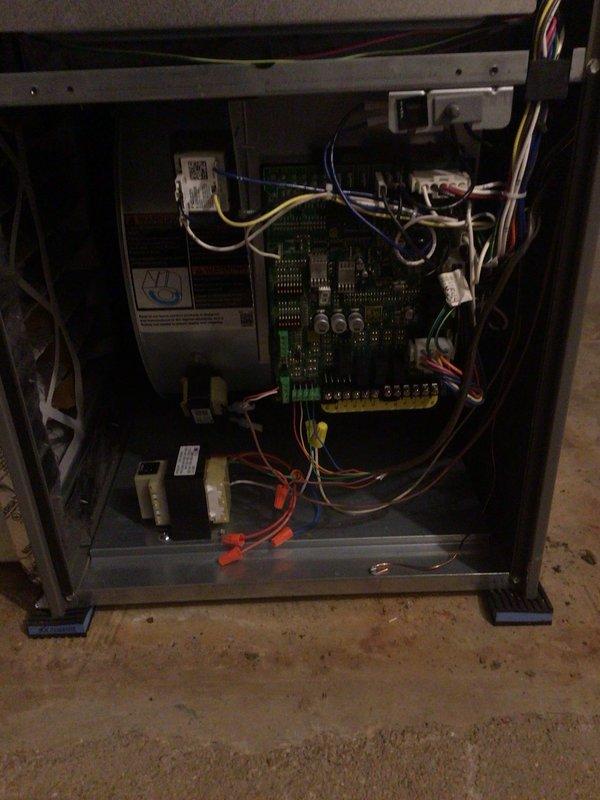 Completed comprehensive cooling tune-up maintenance on two residential AC units: a 2-year-old ground-level unit and a 20-year-old basement unit. Performed standard preventive maintenance procedures including inspection of electrical components and control boards, verification of proper system operation, and air filter assessment on both systems. All equipment photographed and documented for service records, with both units operating within normal parameters upon completion.