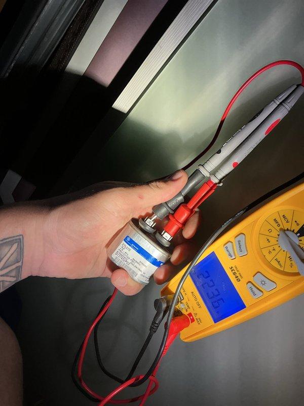 Responded to no cooling call on 5-year-old outdoor unit. Upon arrival, system was completely non-operational with no power to the unit. Performed diagnostic testing and identified failed dual run capacitor as the root cause. Tested capacitor with digital multimeter, confirming readings were out of specification and preventing compressor and condenser fan motor from starting. Replaced defective capacitor with properly rated replacement unit. Verified system startup, confirmed proper amperage draws on both compressor and fan motor, and restored full cooling operation to the system.