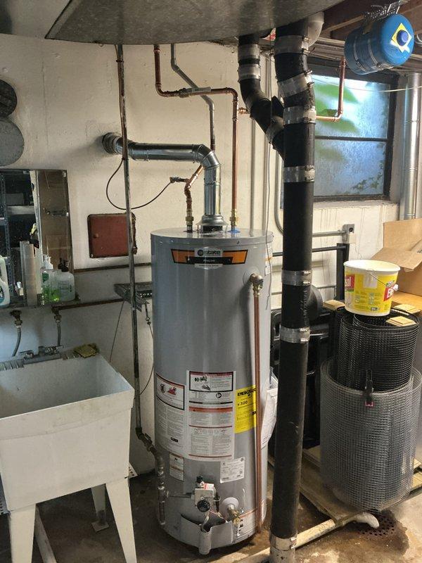 Installed a 50-gallon tall gas water heater in basement utility room, completing all necessary plumbing connections with copper piping, gas line hookup with shutoff valve, and proper venting installation. Unit was set up per manufacturer specifications with expansion tank mounted, pressure relief valve installed, and all connections tested for proper operation and safety compliance.