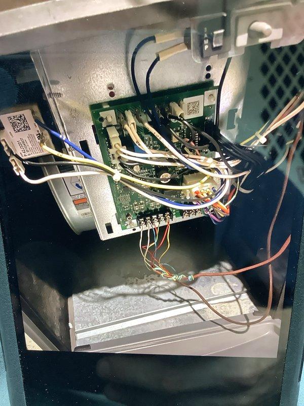 Responded to Home Depot lead F58872711 for a recall service call regarding AC not cooling issue. Inspected two residential split systems (5-year and 12-year units) located at side of home. Accessed indoor unit control board and verified all electrical connections, examined PCB wiring harness and control circuits. Inspected outdoor condenser unit mounted on brackets against exterior wall, confirmed refrigerant lines secure and unit operational. Documented system conditions with photos of control board assembly and outdoor equipment for warranty records.