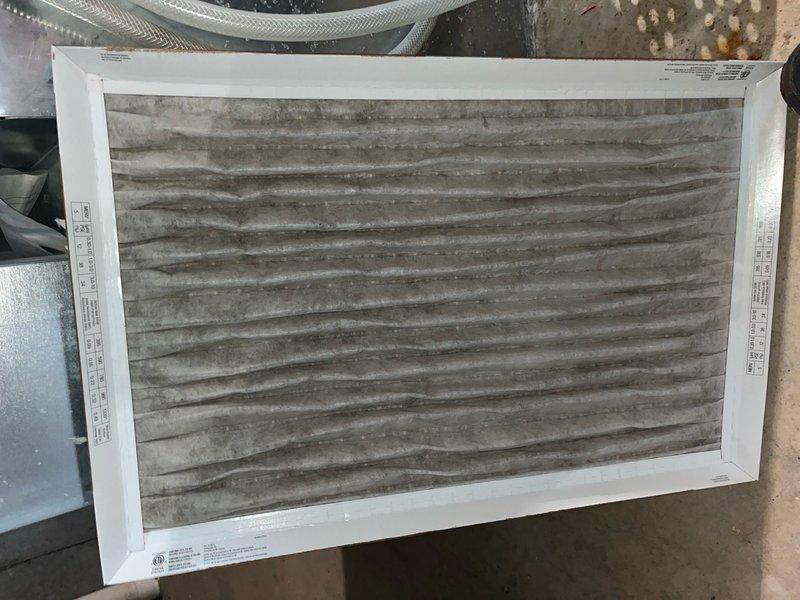 # HVAC Cooling System Tune-Up Completed

Performed comprehensive preventive maintenance tune-up on residential air conditioning unit located on side of home. Accessed indoor air handler unit, inspected electrical control panel including contactors and circuit breakers, verified all wiring connections secure. Examined blower motor assembly and internal components for proper operation. Replaced heavily soiled air filter showing significant particulate buildup and discoloration. Documented equipment condition through photography. System operational upon completion of maintenance service.