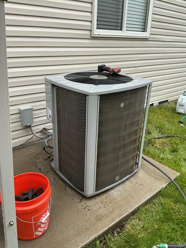 Completed comprehensive tune-up service on two 5-year-old residential air conditioning systems as part of Home Depot preventive maintenance program. Both condensing units, located on ground-level concrete pads with exterior disconnect boxes, were inspected, cleaned, and tested to ensure optimal performance and efficiency. All components on both systems were found to be in good working condition with proper airflow through mesh-protected coils and functioning fan assemblies.