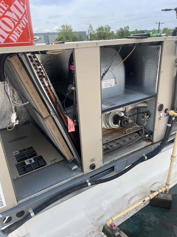Responded to rooftop HVAC units requiring repair work on two separate systems. Successfully replaced failed capacitor on TRA-4 unit, restoring proper operation. Performed comprehensive leak search on TRA-5 system, accessing internal components and inspecting refrigerant lines, coils, and connections. Both units are rooftop-mounted cylindrical condensers serving the building. Parts utilized from truck stock inventory for immediate completion of repairs.