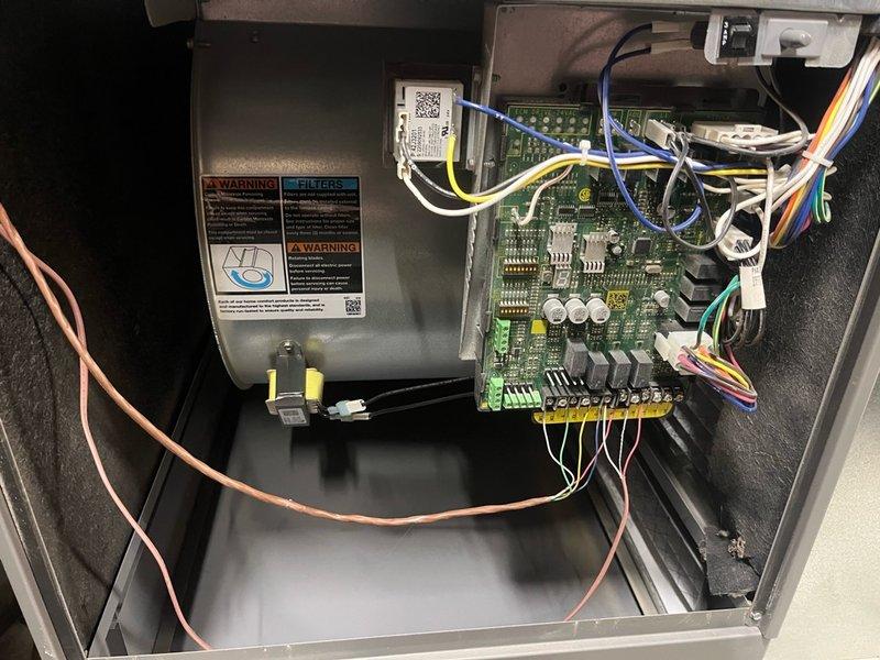 Completed routine cooling maintenance on a 2-year-old AC system. Performed comprehensive tune-up including inspection of control board, blower motor assembly, electrical connections, and wiring harness. Inspected and evaluated air filter condition, noting accumulated dust and debris in pleated media. Verified all system components operational and functioning properly with no deficiencies found.