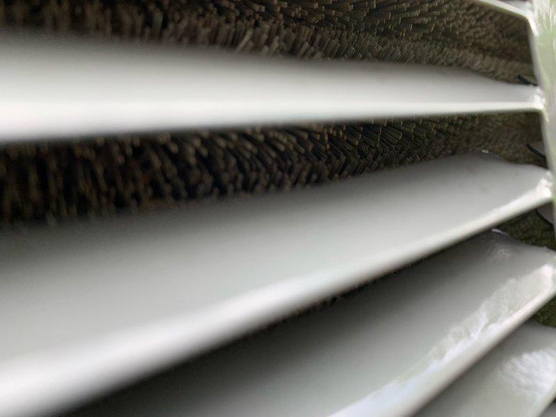 Completed cooling tune-up on single AC unit located at side of home. Inspected evaporator coil and found fins in good condition with minimal debris accumulation. Checked 20x25x4 pleated air filter showing normal dust collection, indicating proper system airflow and filtration performance.