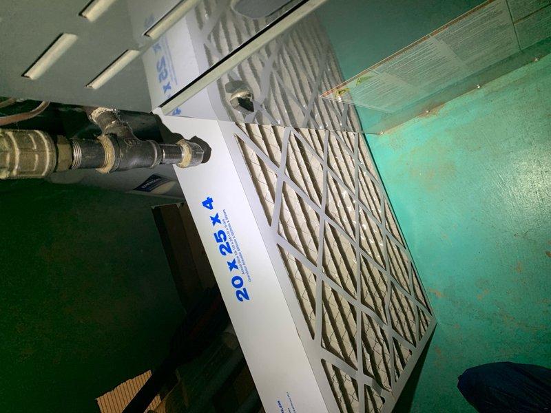 Completed cooling tune-up on single AC unit located at side of home. Inspected evaporator coil and found fins in good condition with minimal debris accumulation. Checked 20x25x4 pleated air filter showing normal dust collection, indicating proper system airflow and filtration performance.