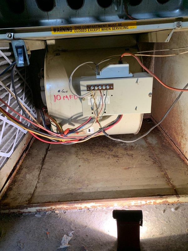 Completed comprehensive cooling system tune-up on 15+ year old outdoor unit located in backyard. Performed standard maintenance protocol including inspection of electrical components, capacitor testing (10 MFD dual run capacitor verified and documented), condenser coil cleaning, refrigerant charge verification, and overall system performance evaluation. Unit operational upon departure with all safety controls functioning properly.