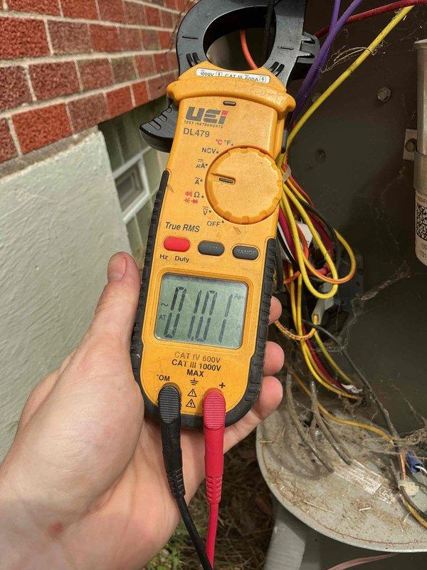 Completed comprehensive cooling system tune-up on residential AC unit located on side of home. Performed standard maintenance protocol including system inspection, electrical testing with clamp meter showing 20.00 amp draw, and identified heavily soiled return air filter requiring attention due to significant dust and debris accumulation across louvers. All measurements within normal operating parameters; recommended filter cleaning or replacement to maintain optimal airflow and system efficiency.