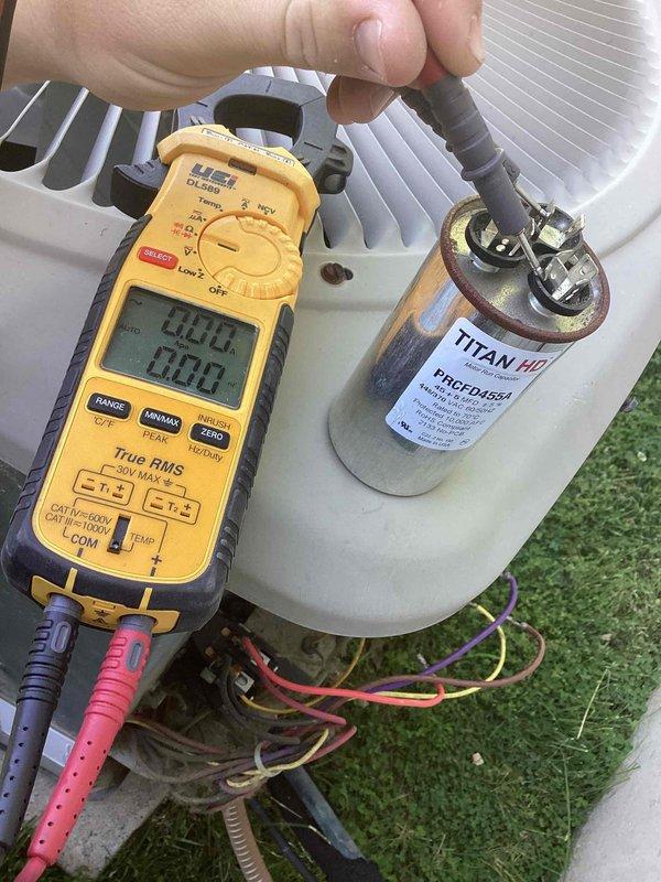 Responded to no cooling complaint on 2011 residential air conditioning system. Upon arrival, confirmed unit was running but not cooling the home adequately. Performed diagnostic testing on outdoor condensing unit and identified failed run capacitor using digital multimeter. Measured capacitance and amperage readings which confirmed capacitor was out of specification and preventing compressor from operating efficiently. Replaced defective capacitor with new TITAN HD motor run capacitor (model PRCFD455A), verified proper electrical connections, and tested system operation. Unit restored to normal cooling operation with all components functioning within manufacturer specifications.