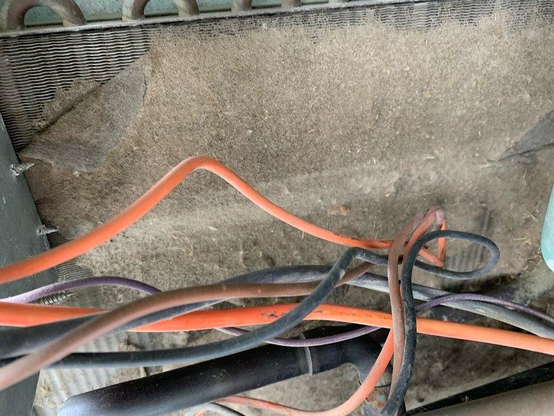 Responded to no-cool service call on 15-year-old residential central AC system. Upon inspection, discovered severely clogged evaporator coil with heavy dust and debris accumulation blocking airflow and heat transfer capability. Explained to customer that the restricted coil was preventing proper refrigerant heat exchange, causing system to run without cooling output. Recommended thorough coil cleaning and full system maintenance to restore cooling function and prevent compressor damage from continued operation under restricted conditions.