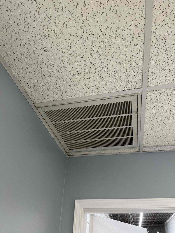 Extended ductwork on TRA24A unit to properly connect to the filter rack, ensuring correct airflow and system operation. Removed existing ceiling access panel to access HVAC components, completed ductwork modifications, and verified proper attachment to filter rack. System tested and confirmed operational for both heating and cooling modes upon completion.