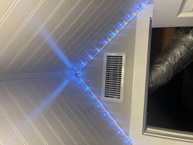 Responded to no cooling complaint in single room following recent system installation. Upon arrival, inspected affected area and located improperly connected or disconnected supply ductwork in ceiling plenum space. Verified vent register in room was not receiving adequate airflow from main AC system. Accessed attic/ceiling area, identified disconnected flexible duct run, and properly reconnected ductwork to supply plenum ensuring secure connection and proper airflow path. Verified system operation and confirmed adequate cooling airflow now present at room register. System restored to proper operation with all zones cooling effectively.