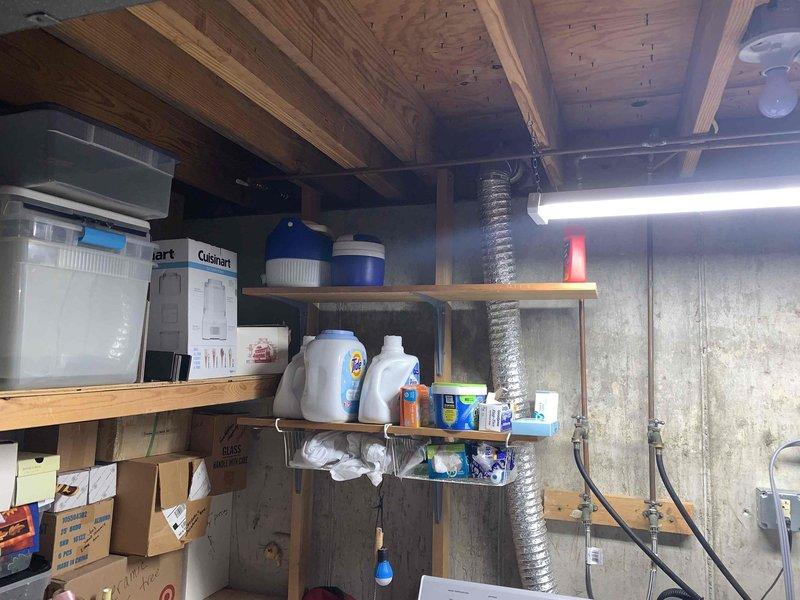 Responded to a clogged drain complaint in a basement utility area. Upon arrival, assessed the basement utility sink and drainage system near the mechanical room and storage area. Cleared the obstruction from the drain line, restoring proper water flow and drainage function to the sink.