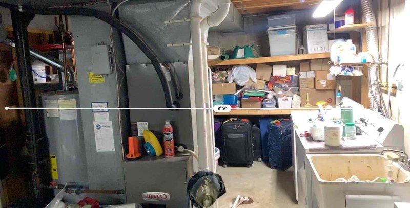 Responded to a clogged drain complaint in a basement utility area. Upon arrival, assessed the basement utility sink and drainage system near the mechanical room and storage area. Cleared the obstruction from the drain line, restoring proper water flow and drainage function to the sink.
