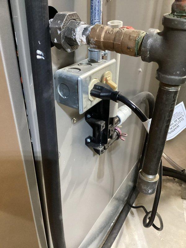 Completed installation of E80 whole-home dehumidification system in basement mechanical room. Unit was mounted on concrete floor adjacent to existing HVAC air handler, with all necessary ductwork connections, condensate drainage plumbing, and electrical wiring installed per manufacturer specifications. System was tested and verified operational with digital controls programmed and functioning properly.