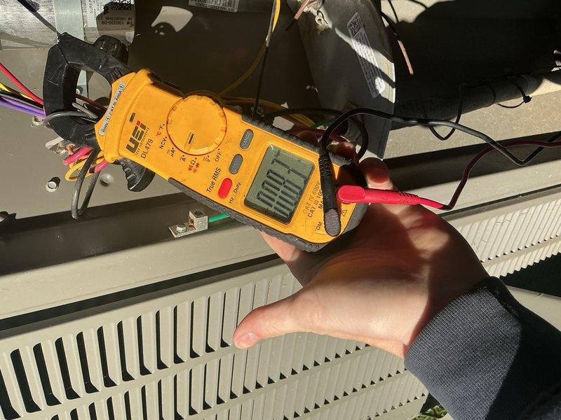 Completed comprehensive cooling maintenance on a 9-year-old air conditioning system. Performed standard AC tune-up procedures including electrical diagnostics and system performance testing using clamp meter multimeter to verify proper amperage draw and voltage readings at the air handler unit. Inspected all electrical connections, tested blower motor operation, and confirmed system is functioning within manufacturer specifications. Unit operating properly with no deficiencies noted at time of service.