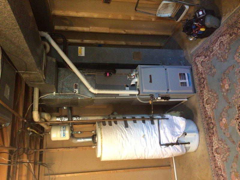 Completed comprehensive cooling maintenance tune-up on 9-year-old AC system. Cleaned condenser coils at outdoor unit, cleaned evaporator coil, and verified refrigerant charge levels within manufacturer specifications. System tested and confirmed operating properly with thermostat responding correctly to temperature setpoints.