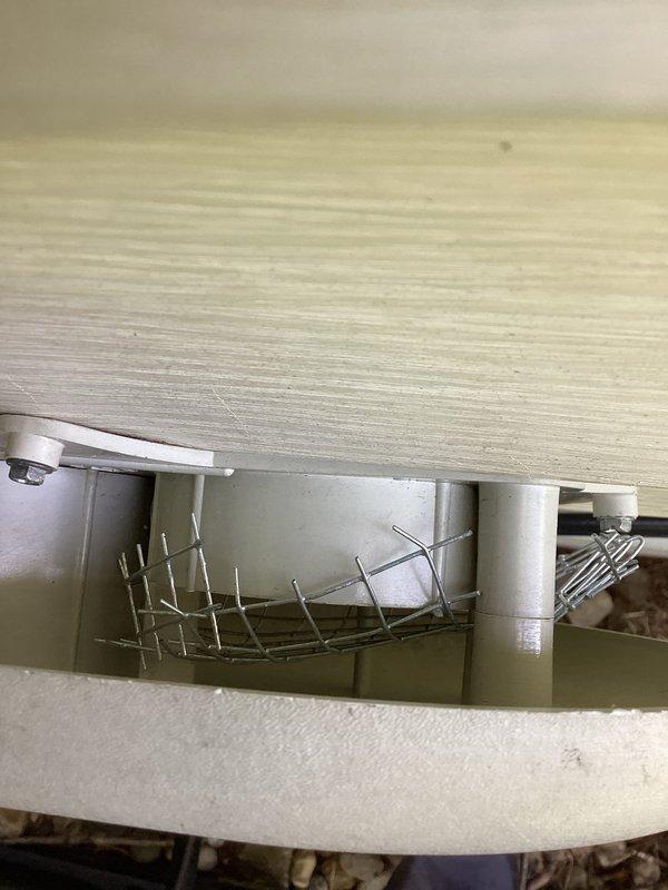 Installed protective wire screen guard over exterior HVAC vent opening to prevent birds from nesting inside the system. The screen cover was securely mounted to the underside of the outdoor structure overhang, ensuring proper airflow while blocking wildlife access to the ventilation system.