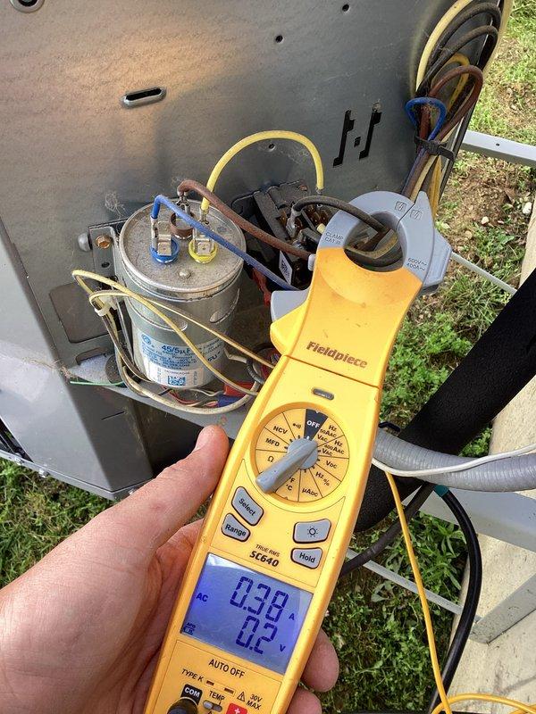 Completed preventative maintenance tune-up on single outdoor air conditioning unit. Performed comprehensive system diagnostics including electrical testing with digital multimeter, measured capacitor performance showing 488.1 microfarads, and verified compressor amperage draw at 0.38 amps using clamp meter. All electrical components tested within normal operating parameters, connections secured, and unit confirmed operational.