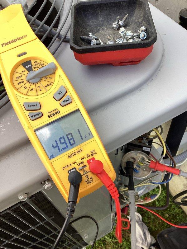 Completed preventative maintenance tune-up on single outdoor air conditioning unit. Performed comprehensive system diagnostics including electrical testing with digital multimeter, measured capacitor performance showing 488.1 microfarads, and verified compressor amperage draw at 0.38 amps using clamp meter. All electrical components tested within normal operating parameters, connections secured, and unit confirmed operational.