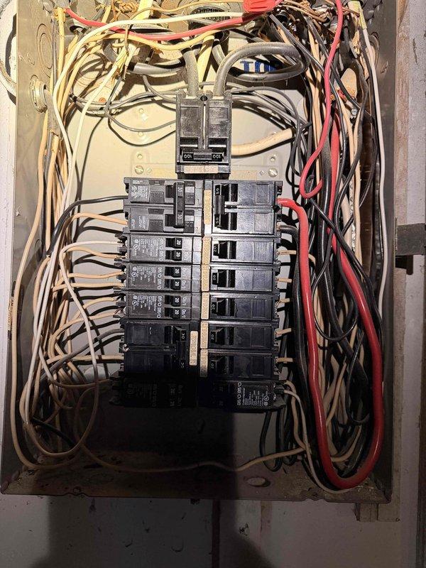 Responded to report of overheated and corroded wire at top left breaker position in main electrical panel. Upon inspection, identified compromised wire connection exhibiting heat damage and corrosion at terminal point. De-energized panel, removed affected breaker, trimmed back damaged conductor to clean copper, and reinstalled with proper torque specifications. Verified all connections were secure, tested circuit functionality, and confirmed panel was operating safely with no additional heat signatures or loose terminations detected.