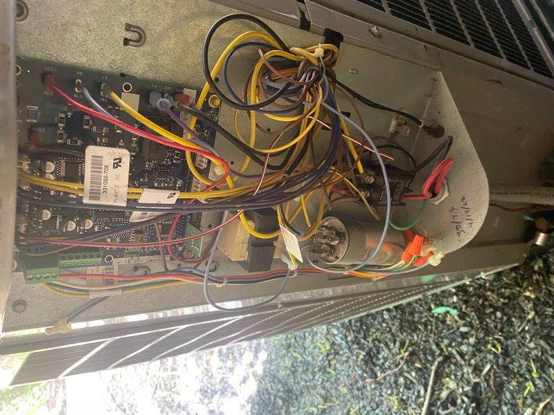 Completed comprehensive cooling season tune-up on 12-year-old residential AC system, including inspection of electrical components, contactors, and control board wiring within the outdoor unit. Removed heavy accumulation of dirt and debris from condenser coil guard and top mesh screen to restore proper airflow and system efficiency.