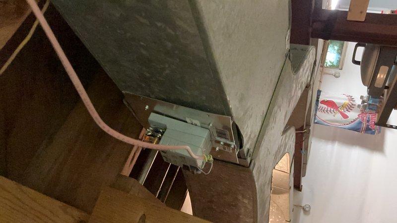 Responded to service call for whistling noise reported throughout home from 2-unit HVAC system. Inspected 10-year-old air handler unit located in attic space and examined ductwork panels. Identified source of constant, loud whistling sound audible in multiple rooms. Assessed air handler cabinet, refrigerant lines, and metal ductwork seams for air leaks and loose connections that could generate noise during system operation.
