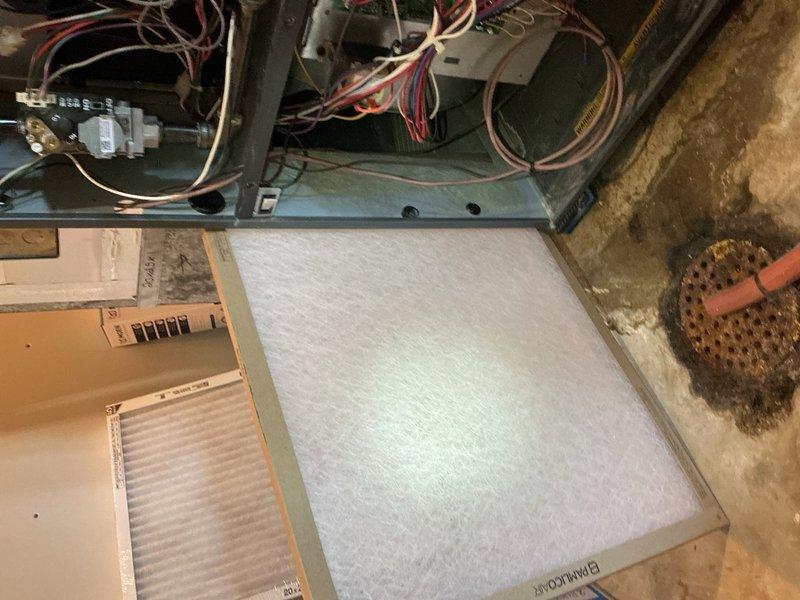 Completed comprehensive cooling maintenance on a 9-year-old air conditioning system. Performed AC tune-up including inspection of condenser coil fins, which were found to be in clean condition with proper airflow clearance, and replaced air filter in the indoor air handler unit. System tested and confirmed operational with all components functioning properly.