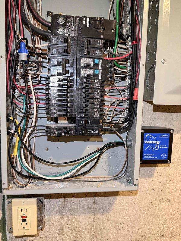 Installed PSP whole-home surge protection device in main electrical panel. Device was properly wired into the panel's bus system and mounted securely to protect all downstream circuits from voltage spikes and surges. Installation completed per manufacturer specifications with all connections verified for proper operation.