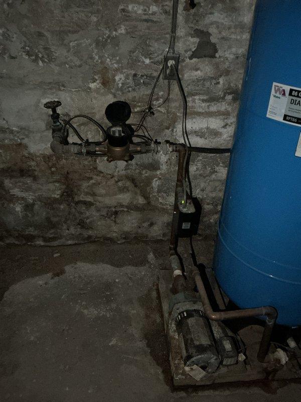Installed 50-gallon gas short water heater in basement utility area, securing unit on cinder blocks for proper elevation and clearance. Connected copper supply lines, gas piping, and metallic vent system to existing infrastructure, ensuring proper venting through ceiling ductwork. Installed necessary pressure relief valve, shut-off valves, and verified all connections for proper operation and code compliance.