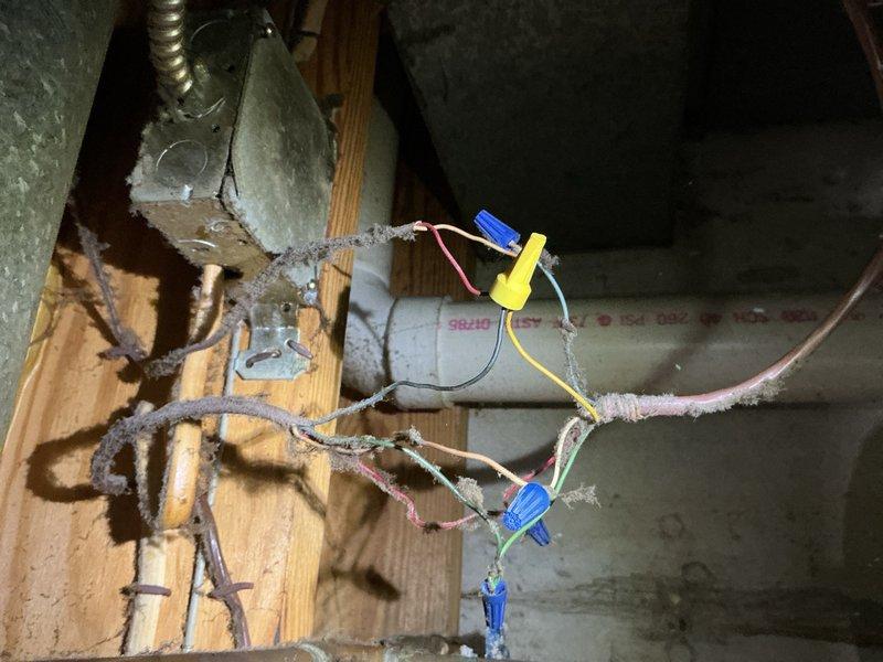 Responded to recall for HVAC system blowing cold air when heating mode selected. Inspected thermostat wiring and heat pump control board connections in attic space. Found improper wire terminations at reversing valve solenoid and control board causing system to remain in cooling mode regardless of thermostat setting. Corrected wire connections, secured all terminations properly, and verified proper operation of reversing valve. System now heating correctly per thermostat commands.