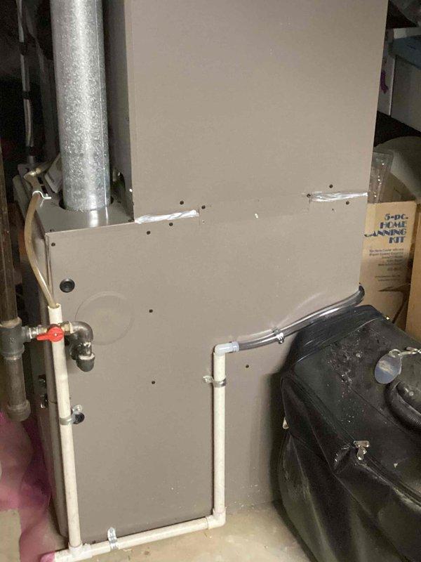 Replaced existing humidifier with AprilAire 600M whole-home humidifier unit on HVAC system. Fabricated and installed 10x10 metal patch on ductwork plenum to accommodate new equipment mounting. Removed and disposed of old humidifier unit, connected water supply lines, and verified system operation with heating and cooling functions.