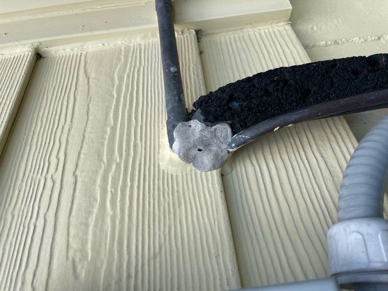 Completed callback for gaps around refrigerant lines entering structure. Inspected exterior and interior penetration points where linesets pass through wall from outdoor unit. Found inadequate sealing at wall penetration allowing air infiltration. Applied appropriate sealant and insulation materials to close gaps around both suction and liquid lines at entry point, ensuring proper weatherproofing and energy efficiency for 10-year-old system.