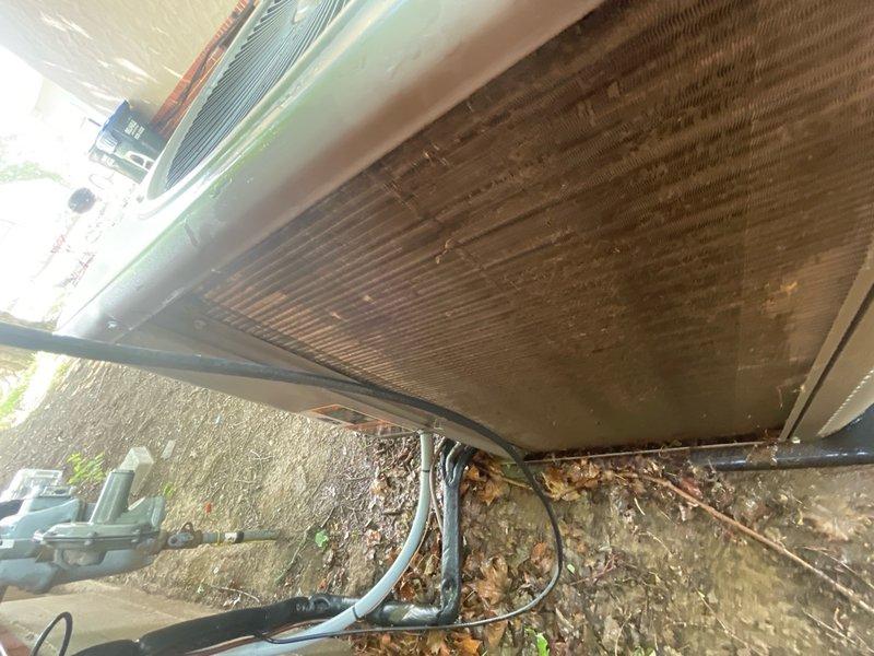 Completed outdoor portion of annual A/C maintenance on residential condenser unit. Performed comprehensive inspection of exterior components including condenser coil, fan assembly, and electrical connections. Cleaned accumulated debris, leaves, and organic matter from around unit base and concrete pad. Verified proper operation of condenser fan and assessed overall equipment condition. Unit operational upon completion of maintenance service.