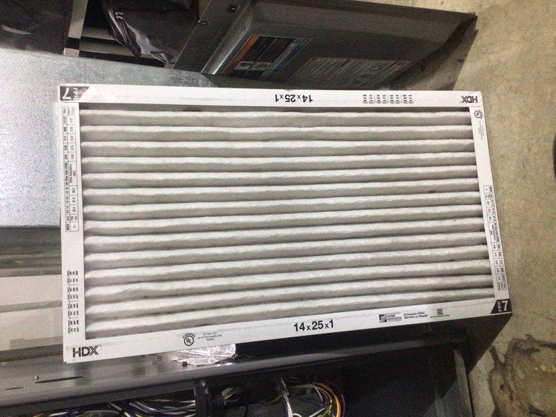 Completed preventive maintenance tune-up on a 31-year-old residential HVAC system for Home Depot service agreement. Inspected outdoor condensing unit, replaced 14x25x1 HDX air filter, and verified system operation with no accessories present on unit.