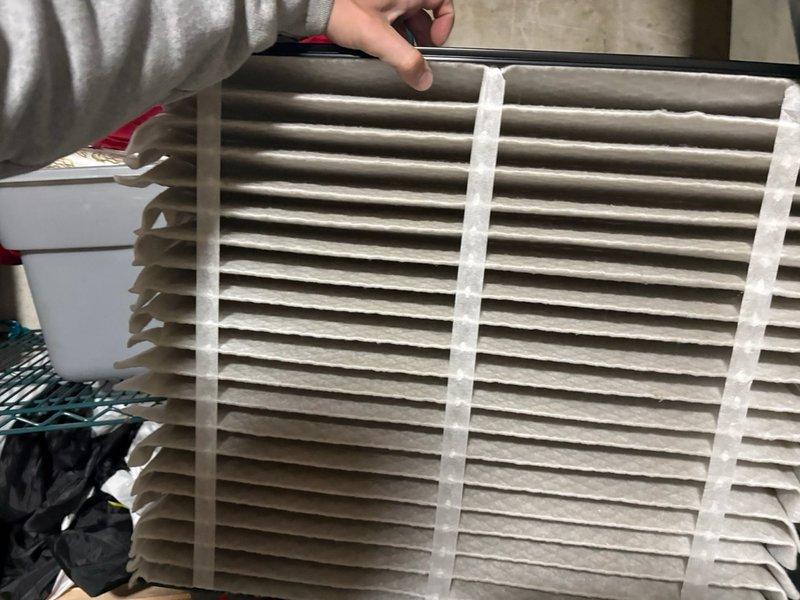 Completed comprehensive AC tune-up on single ground-level unit, including inspection of condenser coil fins and replacement of dirty air filter. System evaluated for proper operation, with photographic documentation of condenser coil condition and used filter showing normal dust accumulation from regular use.