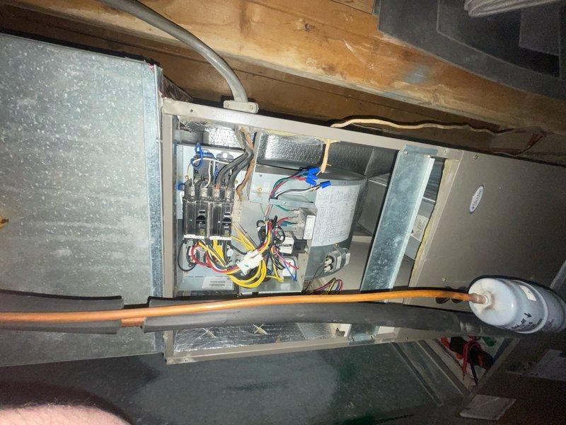 Responded to no heat call for 10+ year old furnace system located in basement blowing cold air. Upon arrival, performed diagnostic inspection of air handler unit and electrical control panel. Inspected all electrical connections, wire terminals, capacitors, and circuit breakers within control panel. Verified proper wiring configuration including line voltage connections, control wiring, and safety circuits. Checked blower motor assembly and associated electrical components for proper operation. System restored to normal heating operation and tested to confirm proper temperature output.