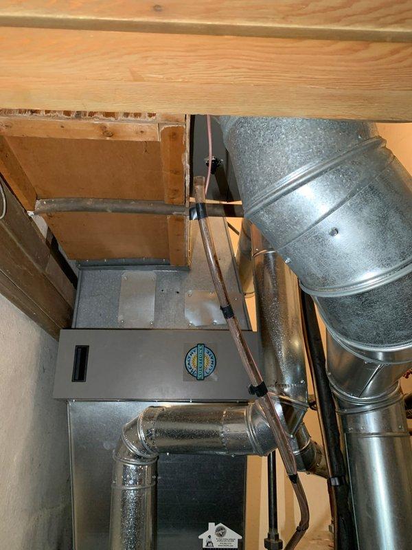 Responded to callback for drainage hose issue following recent maintenance on main level HVAC unit over 10 years old. Upon arrival, inspected air handler and ductwork system in basement utility space. Located disconnected condensate drain line that had been left unattached during previous service visit. Reconnected drainage hose to proper discharge point and verified secure connection. Tested system operation to confirm proper condensate drainage flow and ensured no water leakage at connection points. Unit operating normally with all drainage components properly secured and functioning as designed.
