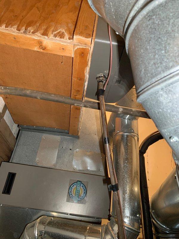 Responded to callback for drainage hose issue following recent maintenance on main level HVAC unit over 10 years old. Upon arrival, inspected air handler and ductwork system in basement utility space. Located disconnected condensate drain line that had been left unattached during previous service visit. Reconnected drainage hose to proper discharge point and verified secure connection. Tested system operation to confirm proper condensate drainage flow and ensured no water leakage at connection points. Unit operating normally with all drainage components properly secured and functioning as designed.
