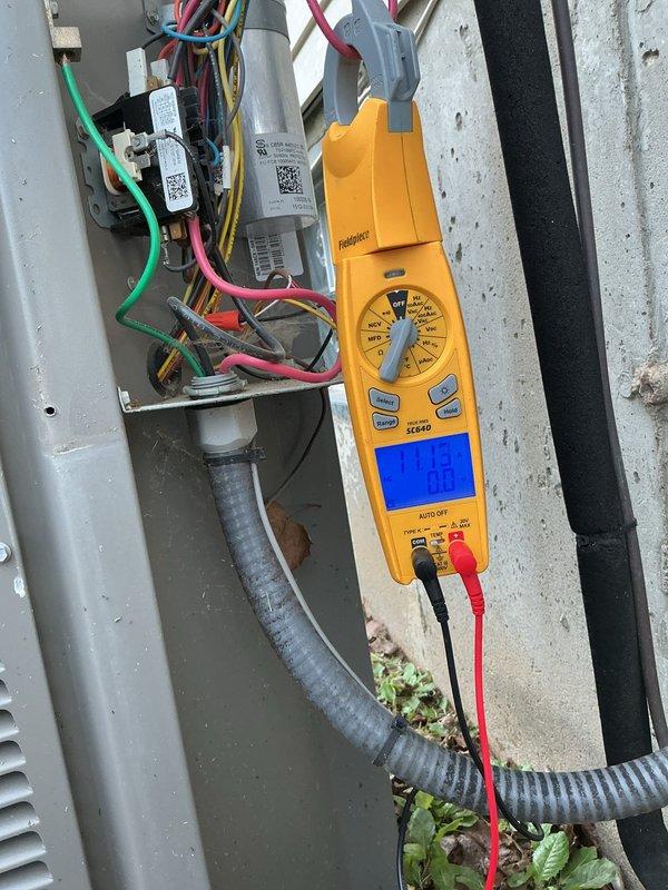 Completed cooling system tune-up on single outdoor AC unit located on basement pad. Performed comprehensive system diagnostics including electrical measurements with amperage reading of 6.09 amps at condenser and voltage testing showing 240V at disconnect panel. Inspected and tested dual-run capacitor, verified all electrical connections, and confirmed proper compressor operation on unit less than ten years old.